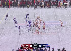 Christian McCaffrey bulldozes a Bill into to snowy gridiron during 20-yard run