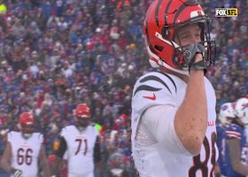 Joe Burrow cuts through snow to find Mike Gesicki for sideline grab