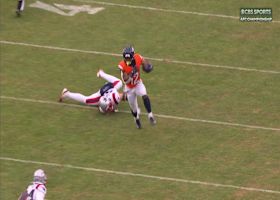 RJ Harvey's hops out of tackler's grasp to gain another Broncos' first down