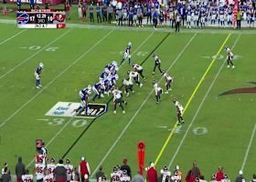 Latu's run after the catch concludes with leap over defender for extra yardage