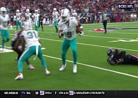 Jonnu Smith shrugs off Texans defender en route to a Dolphins' first down