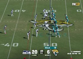 Lawrence rolls out to his right, then delivers a cross-body strike for fourth-down conversion