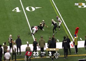 Chris Olave corkscrews to the 38-yard line after snagging Shough's pass