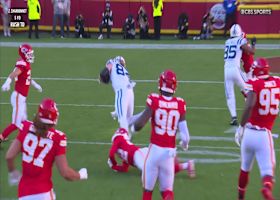 Tyler Warren goes flying for extra yardage on 16-yard gain for red zone access