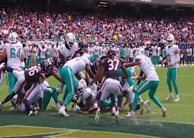 Alexander Mattison reaches across the goal line for the Dolphins' opening score
