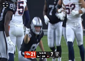 Brock Bowers drags a Bronco for extra yardage on 13-yard gain