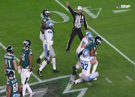 Roy Lopez and Aidan Hutchinson combine for an 11-yard sack on Hurts