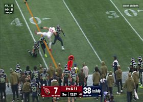 Trey McBride's ambitious hurdle attempt ends with intense collision in Seattle