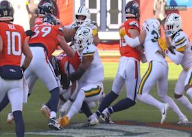 Parsons pries the ball free from RJ Harvey for a turnover on the first drive of Packers-Broncos