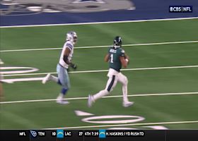 Parsons chases Hurts way out toward the boundary for throw-away pass