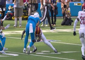 Justin Herbert's 41-yard run ends with a powerful tackle by Mike Sainristil