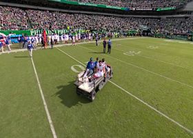 Cam Skattebo taken off field in a cart after lower-body injury vs. Eagles