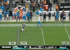 Herbert's 24-yard sideline strike dots Tre Harris near midfield