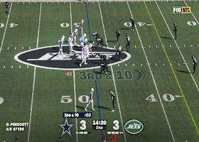 Hunter Luepke charges through two Jets en route to first-down marker