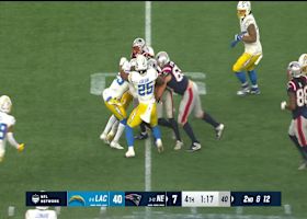 Antonio Gibson drags the Chargers' D with him on way to first down