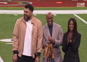 Cam Heyward celebrates the Walter Payton Man of the Year award at Super Bowl LVIII