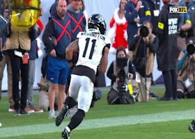 Parker Washington tip-toes down the sideline on 20-yard gain