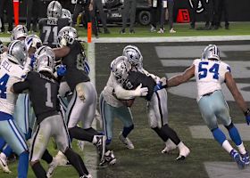 Donovan Ezeiruaku swarms Ashton Jeanty for a safety