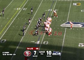 Ernest Jones IV leaps up for an interception of Brock Purdy